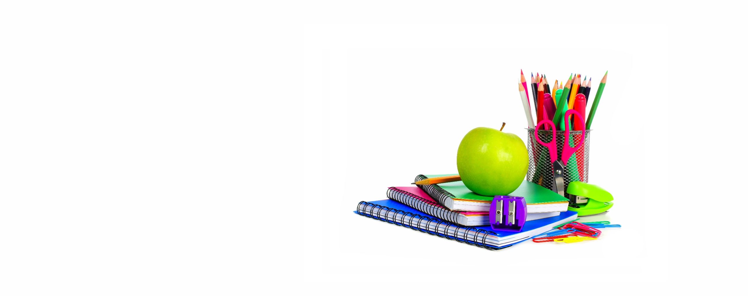 School supplies and green apple